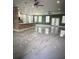 Open concept living room with decorative lighting, ceiling fans, and many windows at 2420 Graham Dr, Orlando, FL 32807