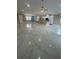 Spacious open-concept living room featuring a ceiling fan, and modern tile flooring at 2420 Graham Dr, Orlando, FL 32807