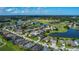 Bird's eye view of a community situated around a golf course and lake, great location at 2530 The Oaks Blvd, Kissimmee, FL 34746