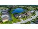 Beautiful aerial view of a home next to a lake and golf course at 2530 The Oaks Blvd, Kissimmee, FL 34746