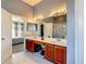 Bathroom featuring double vanity, shower, and views to the bedroom at 2530 The Oaks Blvd, Kissimmee, FL 34746
