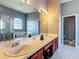 Bathroom with double vanity, shower, separate tub, and great lighting at 2530 The Oaks Blvd, Kissimmee, FL 34746