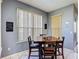 Cozy dining area with natural light offering a pleasant space for meals and gatherings at 2530 The Oaks Blvd, Kissimmee, FL 34746