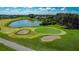 Scenic golf course featuring tranquil lakes, manicured greens, and artfully placed sand traps at 2530 The Oaks Blvd, Kissimmee, FL 34746