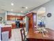 Spacious eat-in kitchen with dark wood cabinets, stainless appliances, and an archway into another room at 2530 The Oaks Blvd, Kissimmee, FL 34746