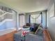 Comfortable living room with hardwood floors and a large sectional sofa at 2530 The Oaks Blvd, Kissimmee, FL 34746
