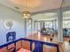 Bright living room featuring hardwood floors, elegant archways, and a view into the sitting room at 2530 The Oaks Blvd, Kissimmee, FL 34746