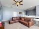 The loft provides extra living space, furnished with a sectional sofa and a small printer station at 2530 The Oaks Blvd, Kissimmee, FL 34746