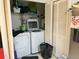 Convenient laundry area with washer, dryer, and storage space at 2770 Club Cortile Cir # A, Kissimmee, FL 34746