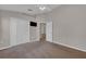 Bedroom with carpet, ceiling fan, and closet for storage, providing a comfortable and functional space at 3196 Verbena Ct, Deltona, FL 32725