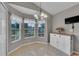 Cozy dining area with large windows and a stylish chandelier at 3196 Verbena Ct, Deltona, FL 32725