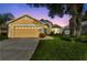 Charming single-story home featuring a well-maintained lawn and two car garage at 3196 Verbena Ct, Deltona, FL 32725