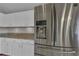 Stainless steel refrigerator complementing the bright white cabinetry and countertops at 3196 Verbena Ct, Deltona, FL 32725