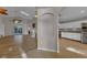 Bright living room with wood floors, fireplace, and sliding glass doors to lanai at 3196 Verbena Ct, Deltona, FL 32725