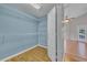 Walk-in closet with blue walls, wood floor, and white wire shelving, offering ample storage space at 3196 Verbena Ct, Deltona, FL 32725
