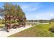 Pergola with picnic tables overlooking the lake and with lush landscaping throughout at 3201 Dallas Blvd, Orlando, FL 32833