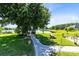 The lush backyard featuring mature trees, a tranquil pond, gazebo, and picnic area creates a serene outdoor retreat at 3201 Dallas Blvd, Orlando, FL 32833