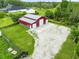 Barn with concrete pad and large driveway on lush green property at 3201 Dallas Blvd, Orlando, FL 32833