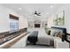 Calming bedroom with custom built-in shelving, wood panel accent wall, and plush carpet at 3201 Dallas Blvd, Orlando, FL 32833