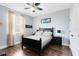 Relaxing bedroom with soft color palette, decorative fan, wood floors, and natural light at 3201 Dallas Blvd, Orlando, FL 32833