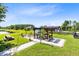 Landscaped backyard featuring a pond view and a pergola with outdoor seating at 3201 Dallas Blvd, Orlando, FL 32833