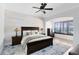 Comfortable bedroom with wood accent wall and lots of natural light from the windows at 3201 Dallas Blvd, Orlando, FL 32833