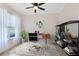 Bright and airy home office with large window, stylish furnishings, and custom shelving at 3201 Dallas Blvd, Orlando, FL 32833