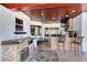 Outdoor kitchen area with stone countertops, built-in stainless steel grill, and outdoor seating at 3201 Dallas Blvd, Orlando, FL 32833