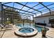 Screened-in pool and spa with lounge chairs to sit back and enjoy the beautiful weather at 3201 Dallas Blvd, Orlando, FL 32833
