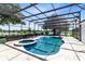 Screened pool area with a beautiful pool, spa and chairs to sit and enjoy the view at 3201 Dallas Blvd, Orlando, FL 32833