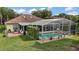 Aerial view of home with large pool and covered, screened-in porch at 3271 Settlers Trl, St Cloud, FL 34772