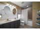 Well-lit bathroom featuring a double vanity, tiled floor, and shower/tub combo at 3271 Settlers Trl, St Cloud, FL 34772