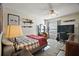 Cozy bedroom with a bed, desk area, and ample natural light from a window at 3271 Settlers Trl, St Cloud, FL 34772