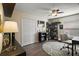 Well-lit bedroom with a ceiling fan, desk area, and closet for storage at 3271 Settlers Trl, St Cloud, FL 34772
