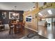Inviting dining room with hardwood floors, stylish decor, and an open-concept design to the kitchen at 3271 Settlers Trl, St Cloud, FL 34772