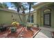 A beautifully landscaped front entrance features palm trees, various plants, and solar lighting at 3271 Settlers Trl, St Cloud, FL 34772