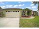 A well-maintained single-Gathering home with a two-car garage, lush lawn, and lovely landscaping at 3271 Settlers Trl, St Cloud, FL 34772