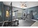 Home gym with rubber flooring, mirrors, and fitness equipment at 3271 Settlers Trl, St Cloud, FL 34772