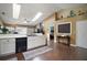 Spacious eat-in kitchen with skylights, white countertops, hardwood floors and stainless steel appliances at 3271 Settlers Trl, St Cloud, FL 34772