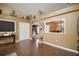 Inviting living room features wood floors, neutral paint, and decor shelves for a unique and cozy living space at 3271 Settlers Trl, St Cloud, FL 34772