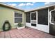 Brick patio area with covered, screened-in porch at 3271 Settlers Trl, St Cloud, FL 34772