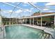 Sparkling pool with screened enclosure and outdoor living space at 3271 Settlers Trl, St Cloud, FL 34772