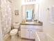 Small bathroom featuring a tub, vanity with sink, and a toilet at 331 Bridgewater Dr, Davenport, FL 33897