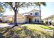 Charming two-story home with a two-car garage, stone accents, and lawn at 331 Bridgewater Dr, Davenport, FL 33897