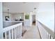 This hallway offers a view into other rooms with white railings at 331 Bridgewater Dr, Davenport, FL 33897