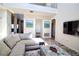 Spacious living room featuring soaring ceilings, modern decor, and plenty of natural light at 331 Bridgewater Dr, Davenport, FL 33897