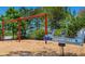 Community playground featuring swings and a airplane spring rider for active recreation at 331 Bridgewater Dr, Davenport, FL 33897