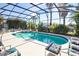 Inviting screened-in pool and spa area with ample seating and lush landscaping at 331 Bridgewater Dr, Davenport, FL 33897