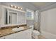 Bathroom featuring a vanity with granite countertop and a tub/shower combination at 3757 Conroy Rd # 2525, Orlando, FL 32839