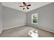 Bedroom featuring a ceiling fan, one window allowing for natural light, and neutral walls at 3757 Conroy Rd # 2525, Orlando, FL 32839